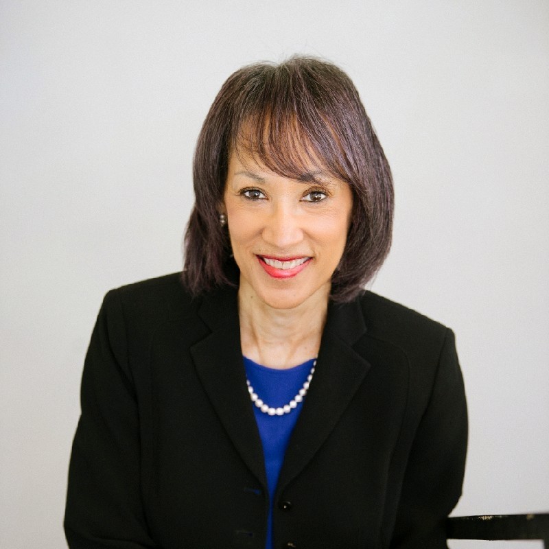 Olivia Branch smiling in a professional headshot wearing a black blazer.