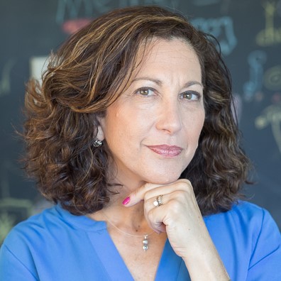 Diane H. Naughton portrait with thoughtful expression.