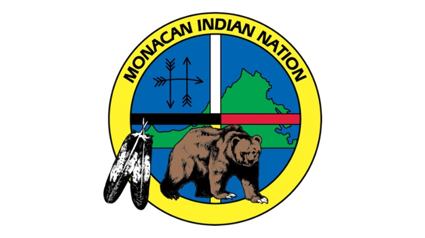 Monacan Indian Nation seal featuring a bear, feathers, and traditional symbols.