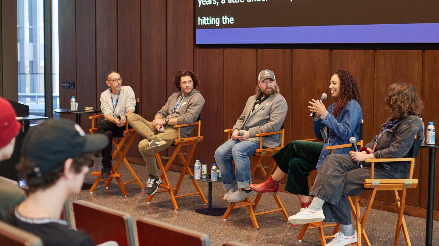 Panel discussion at The Virginia Film Festival with five speakers on stage.