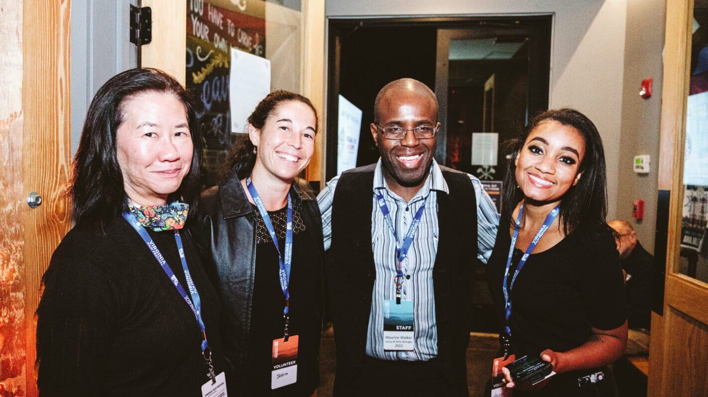 Volunteers and staff smiling at a Virginia event.