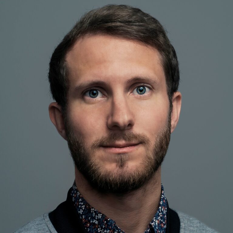 Professional headshot of Daniel Poler.