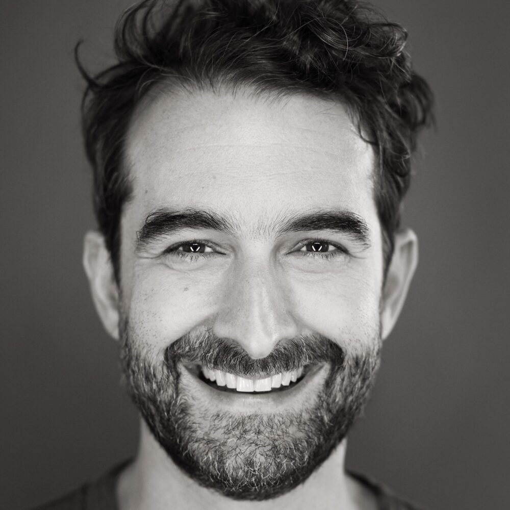 Jay Duplass portrait, smiling with a beard