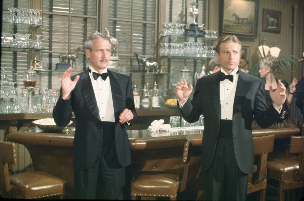 Paul Newman and Robert Redford in The Sting, raising hands