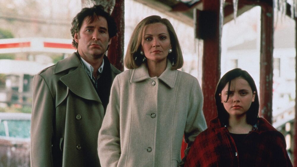 Family from "The Ice Storm" movie standing outside, looking serious.