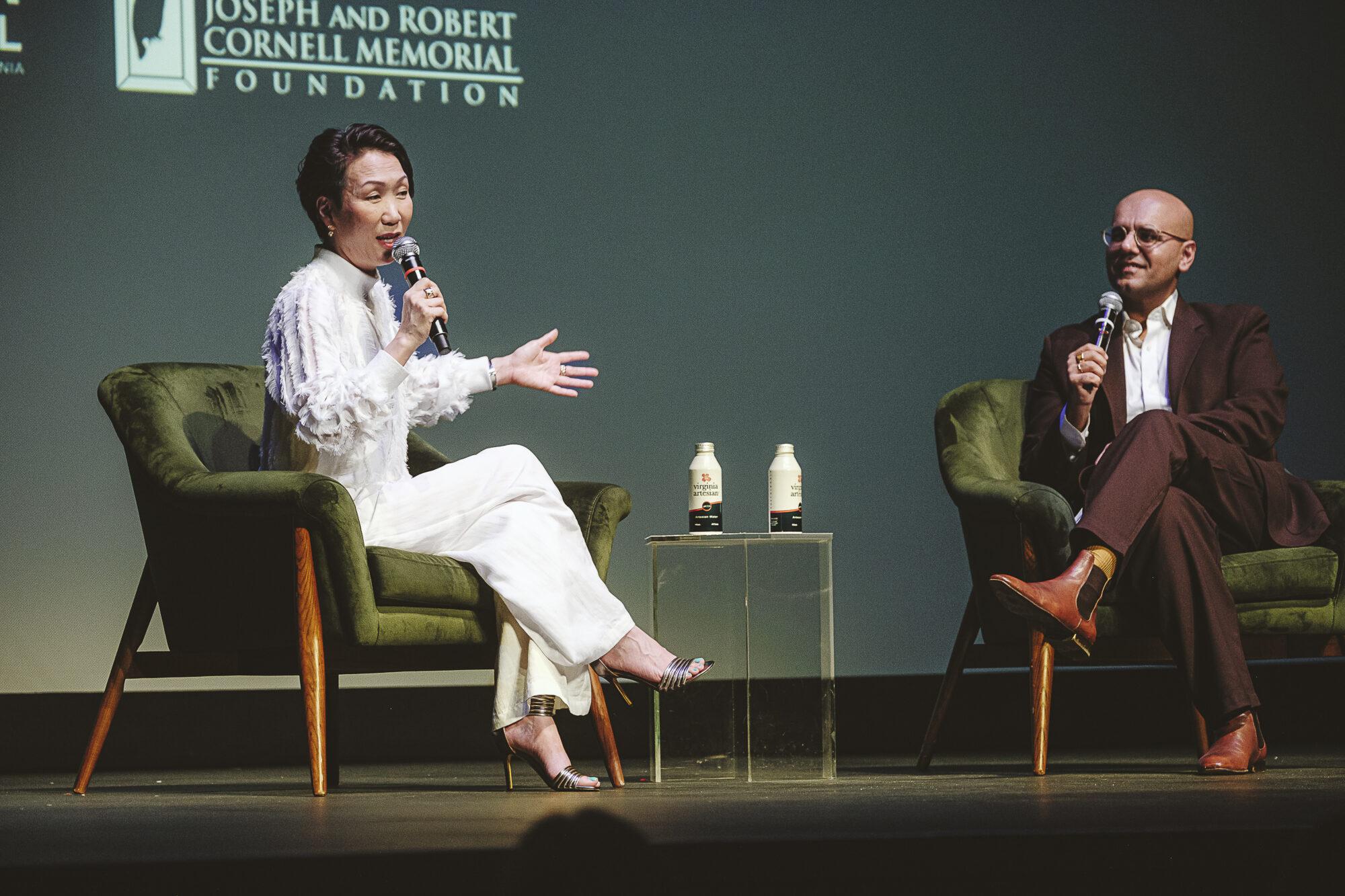 Hikari and Bilal Qureshi onstage at The Paramount Theater discussing the film RENTAL FAMILY.
