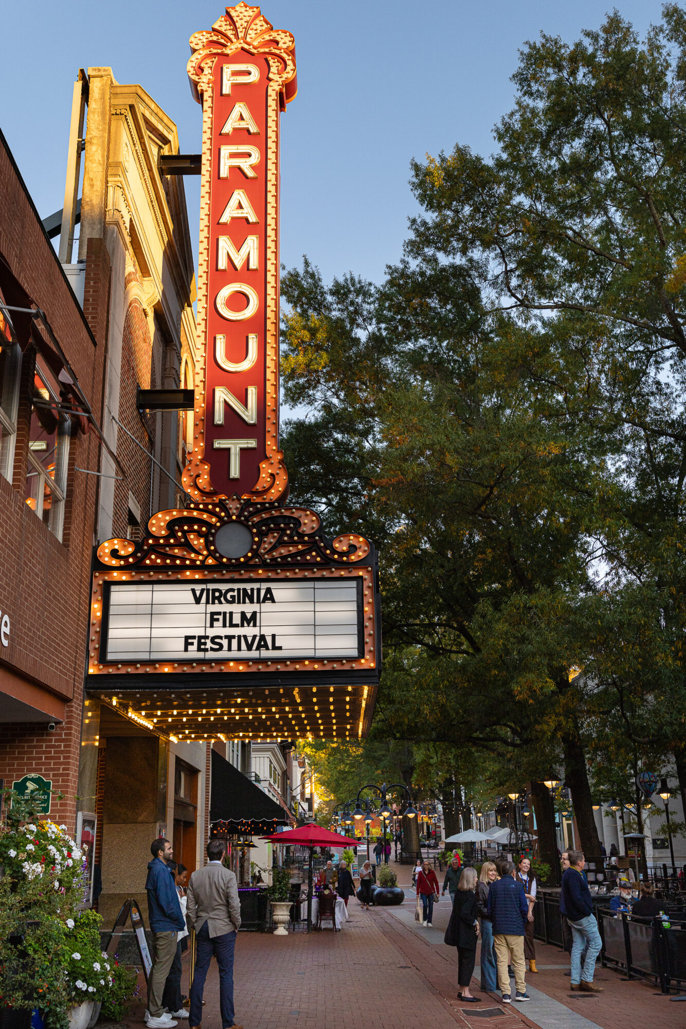 Paramount Theater hosts Virginia Film Festival. Street scene with people walking.